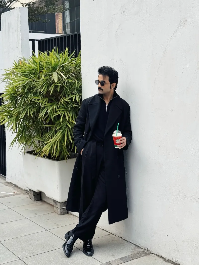 Black Wool Overcoat with Half-Zip Sweater and Relaxed Trousers