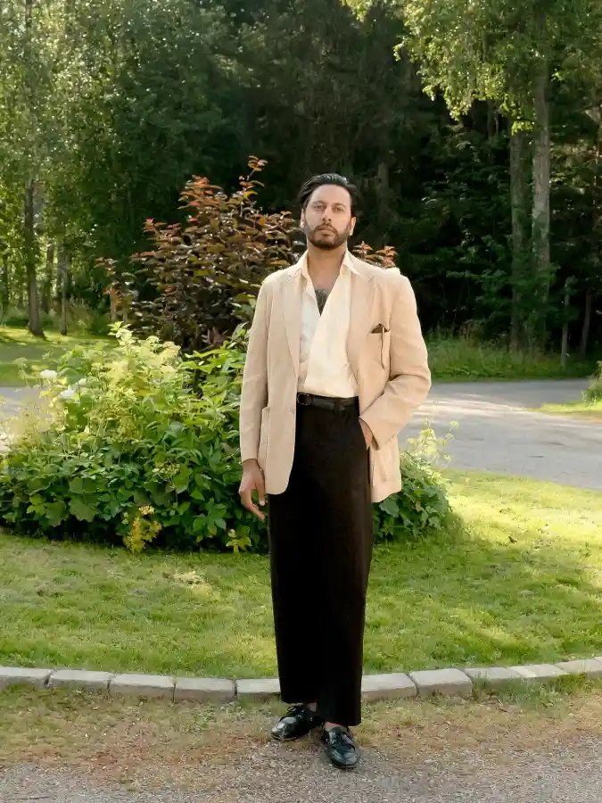 Beige Soft-Tailored Blazer & Black Trousers Elevating Summer Wedding Style