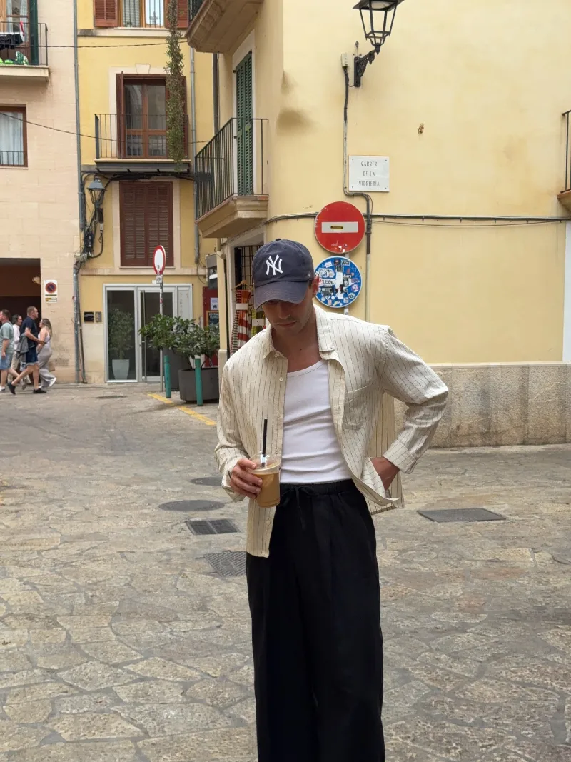 Beige Striped Overshirt with White Tank and Black Drawstring Trousers