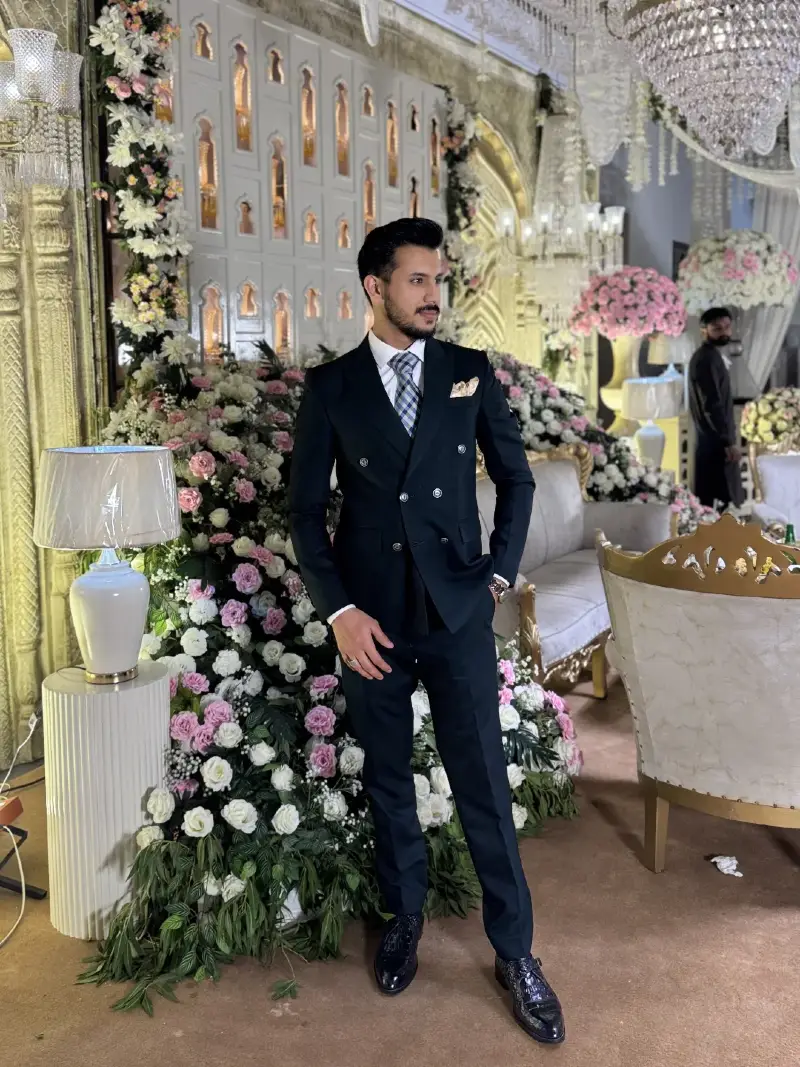 Black Double-Breasted Suit with Plaid Tie and Textured Shoes