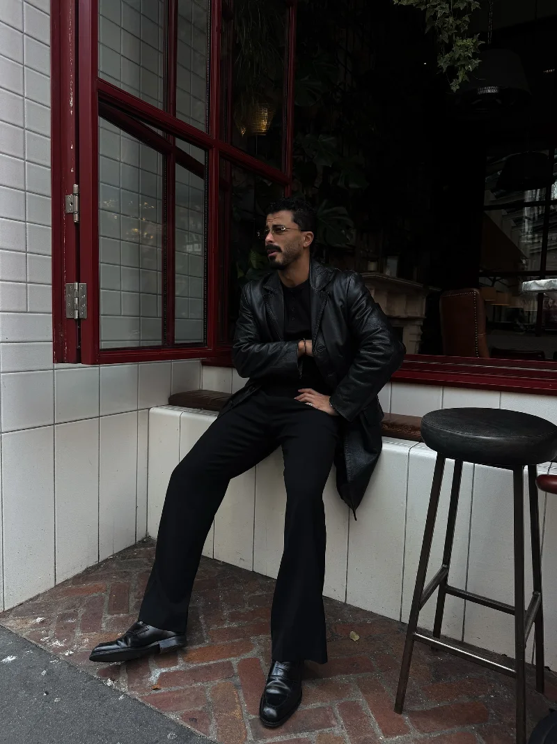 Black Leather Car Coat with Relaxed Trousers and Loafers