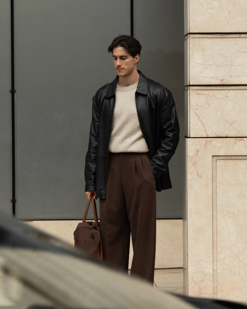 Black Leather Jacket with Cream Knit and Wide Brown Trousers