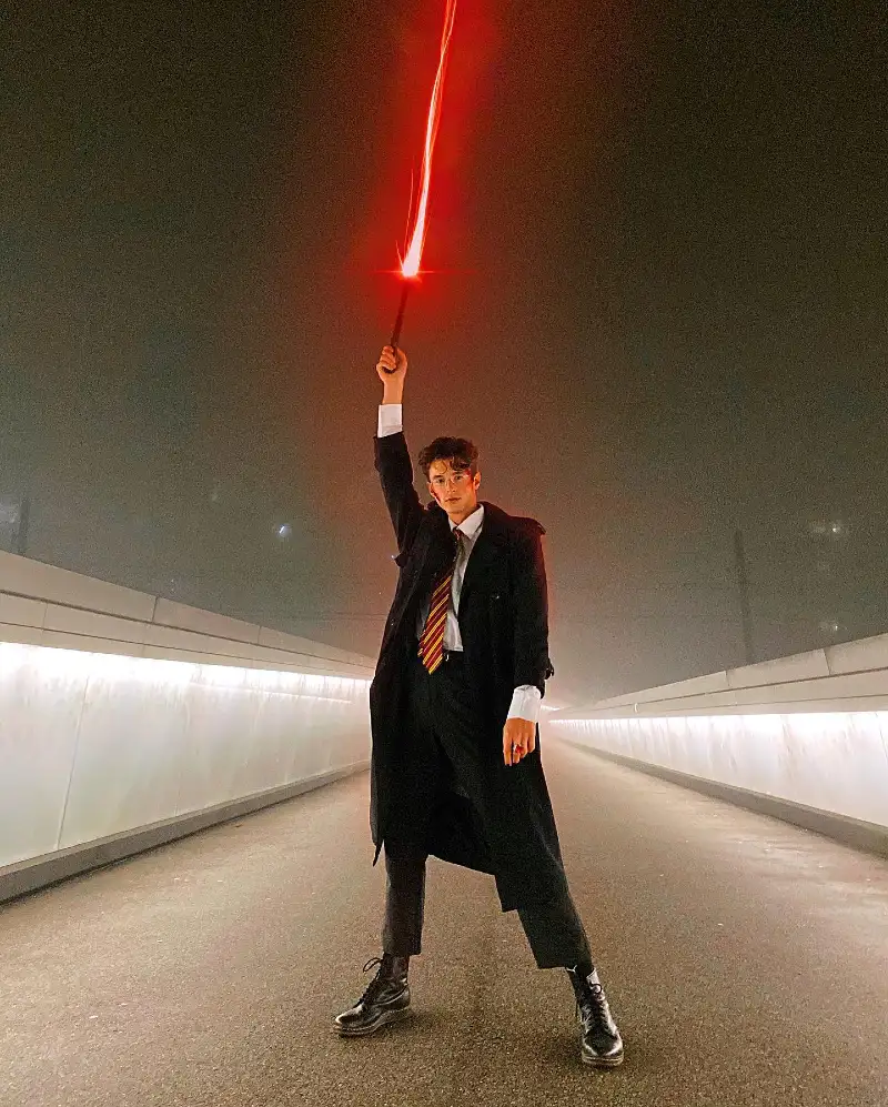 Black Overcoat with Striped Tie and Illuminated Wand