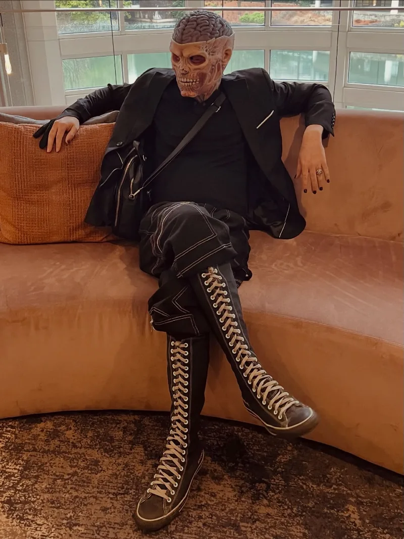 Black Piped Blazer with Contrast-Stitched Cargo Pants and Knee-High Lace-Up Boots