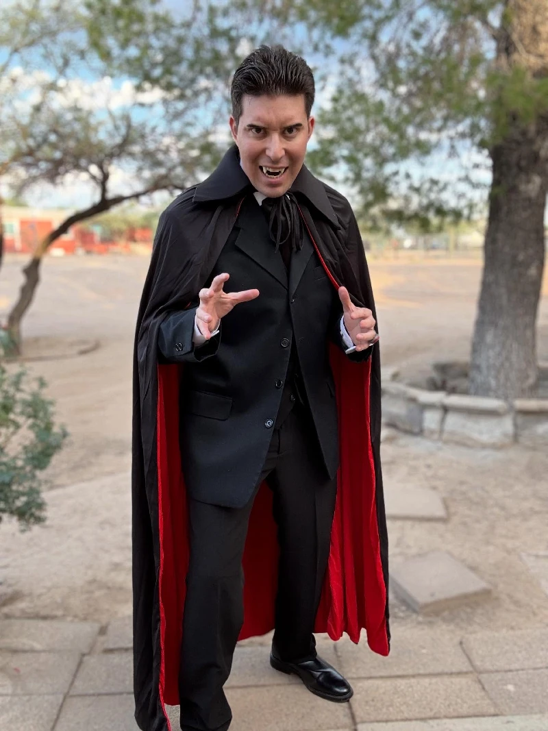 Black Single-Breasted Three-Piece Suit with Crimson-Lined High-Collar Cape
