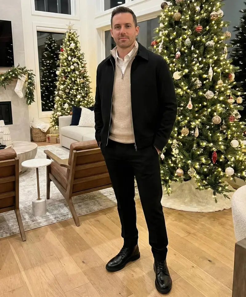 Black Zip Jacket Over Beige Quarter-Zip and Dark Trousers