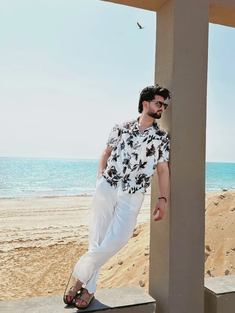 Bold Leaf Print Shirt and Flowing White Trousers