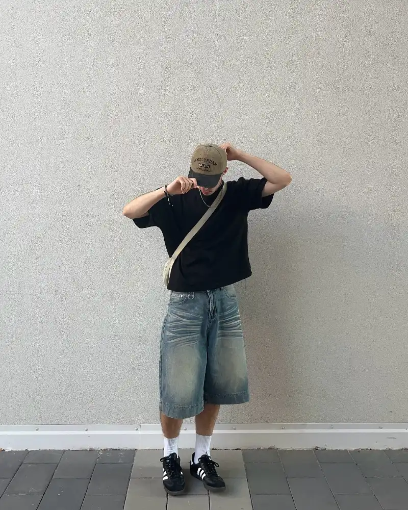 Boxy Black T-Shirt with Heavily Faded Baggy Denim Shorts
