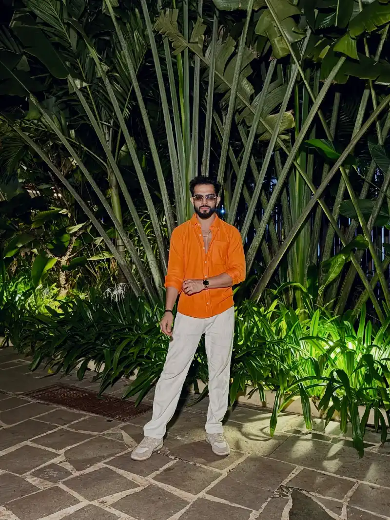 Bright Orange Button-Down with Off-White Trousers and Pale Sneakers