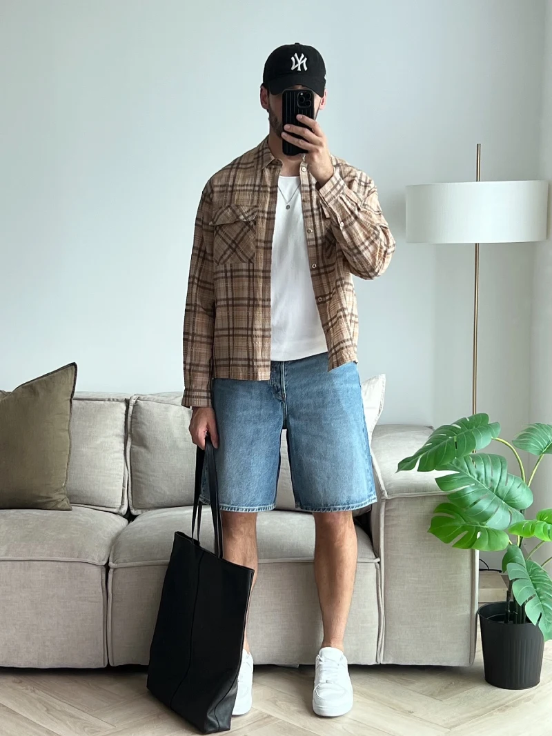 Brown Plaid Overshirt with Light Wash Denim Shorts and White Sneakers