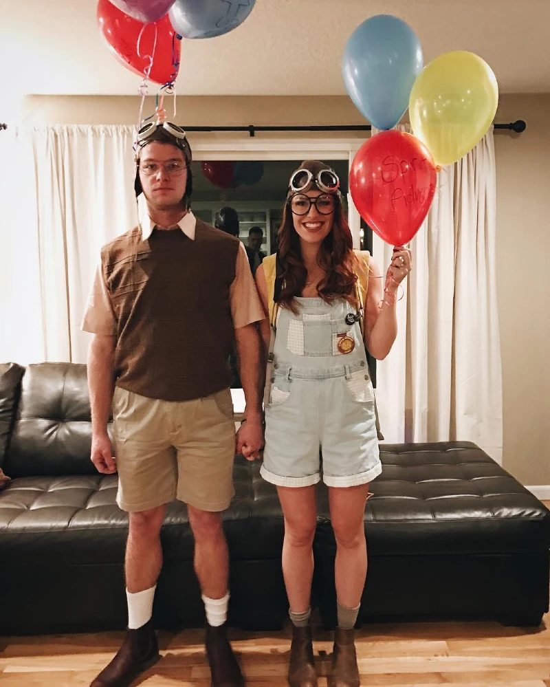 Brown Sweater Vest with Khaki Shorts, Aviator Cap, and Leather Boots