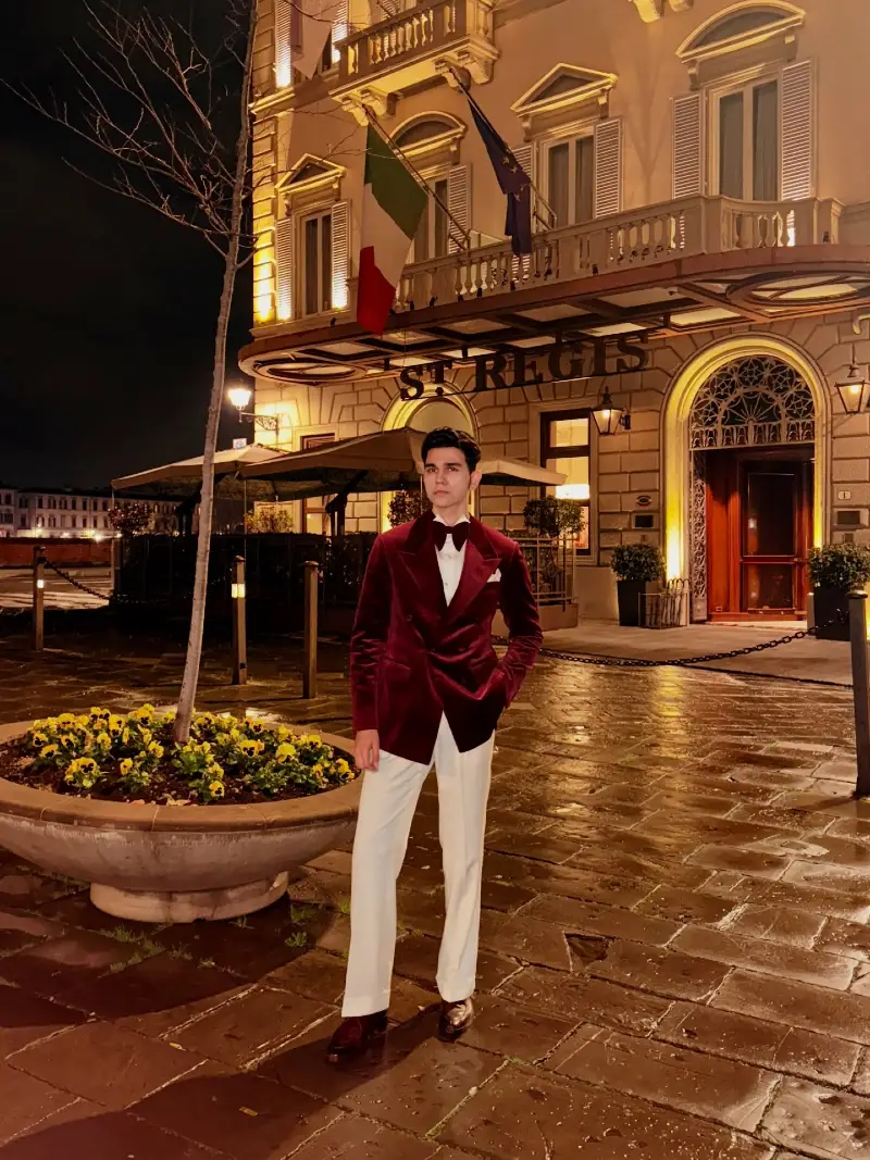 Burgundy Velvet Double-Breasted Jacket with Crisp White Trousers and Matching Bow Tie