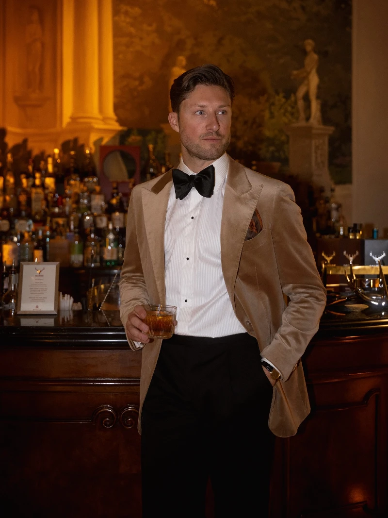 Camel Velvet Dinner Jacket with Black Bow Tie and Studded Shirt