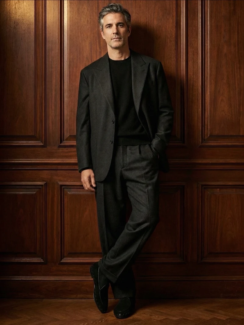 Charcoal Wool Suit with Black Crewneck Sweater and Suede Loafers