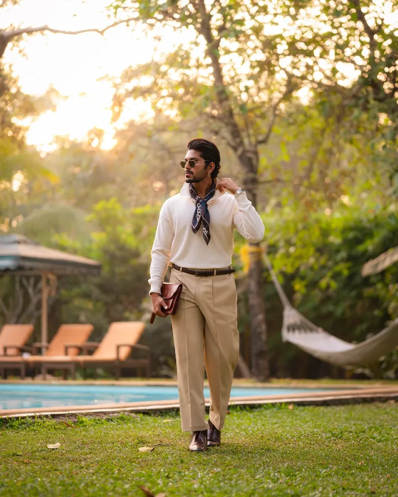 Cream Knit Polo with Khaki Pleated Trousers and Silk Neckerchief