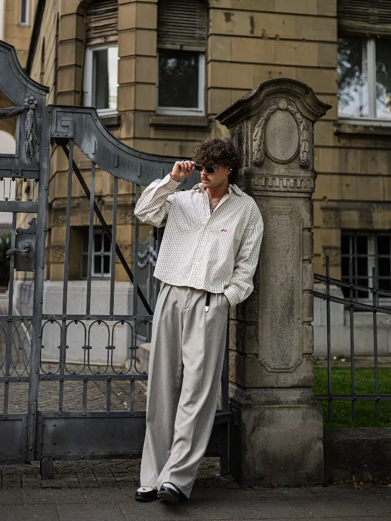 Cropped Striped Shirt with Baggy Grey Trousers and Two-Tone Loafers