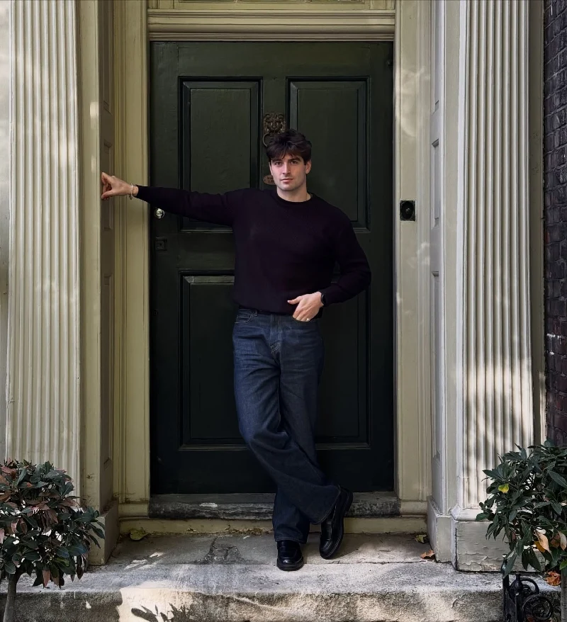 Dark Knit Sweater with Relaxed Indigo Denim and Black Loafers