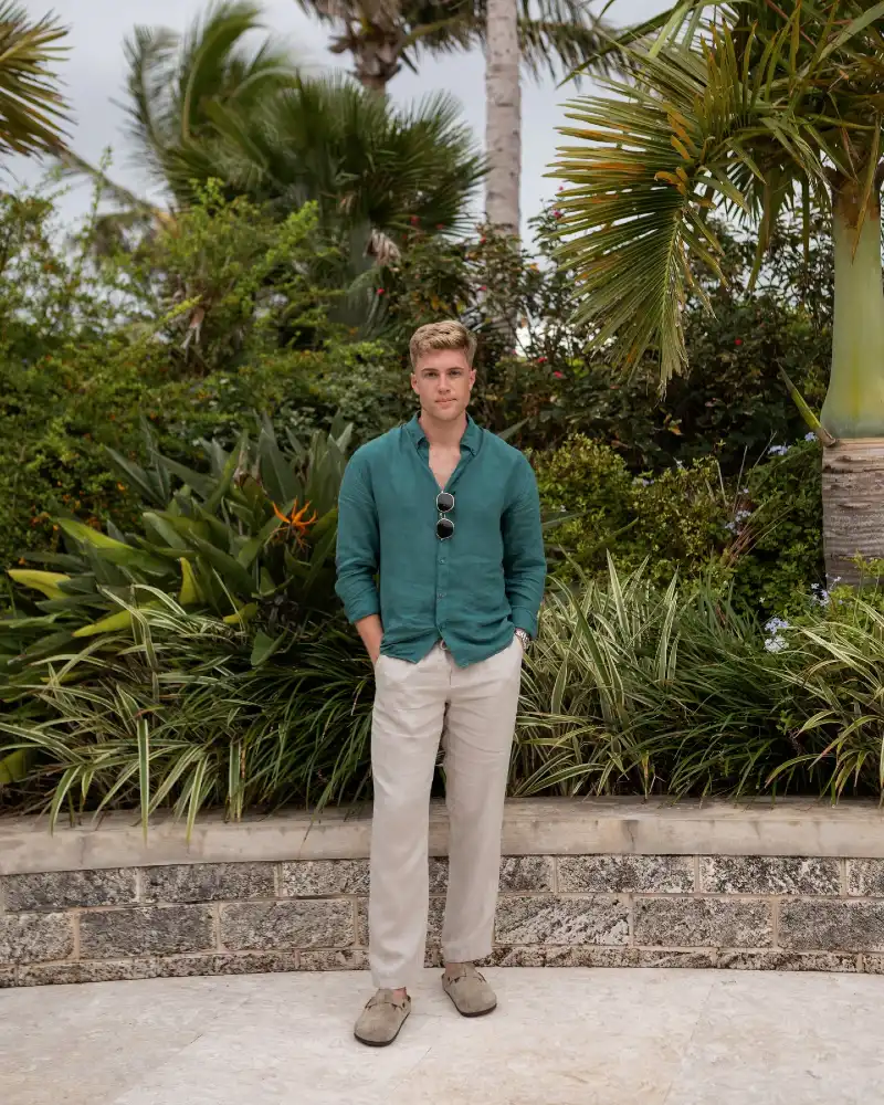 Deep Green Linen Shirt with Beige Trousers and Suede Clogs
