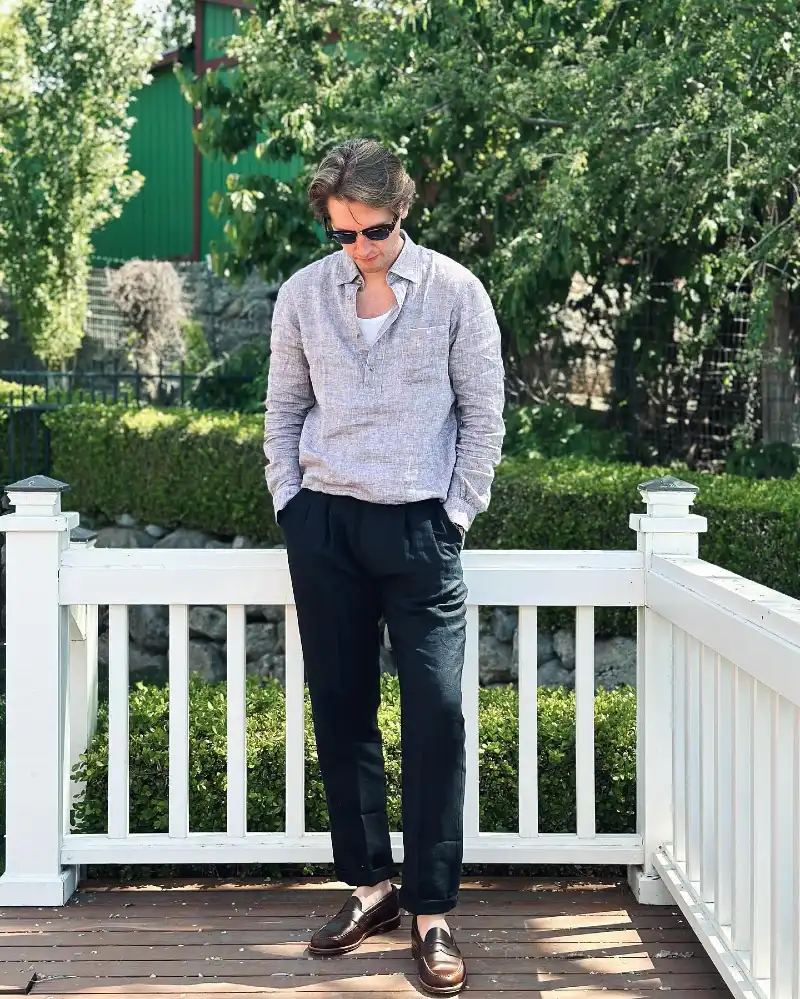 Grey Linen Popover with Black Pleated Trousers and Brown Loafers