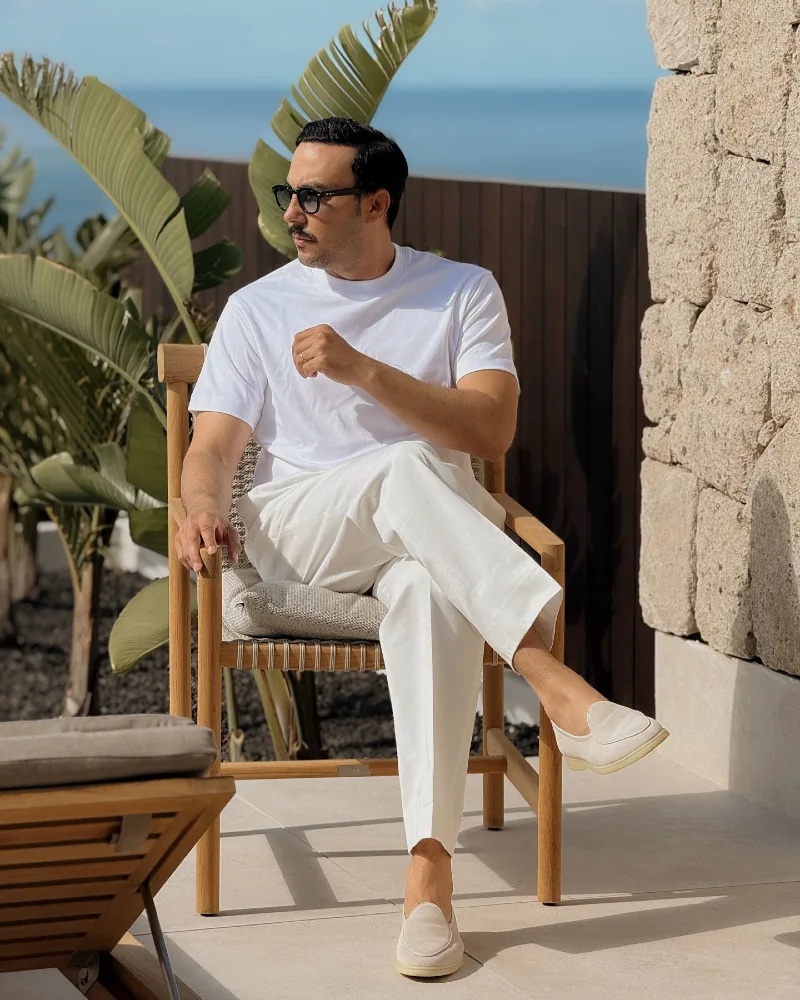 Heavyweight White T-Shirt with Creased Trousers and Suede Loafers