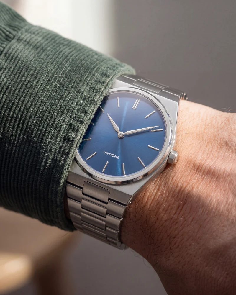 Integrated Steel Bracelet Watch with Sunburst Blue Dial and Green Corduroy Shirt