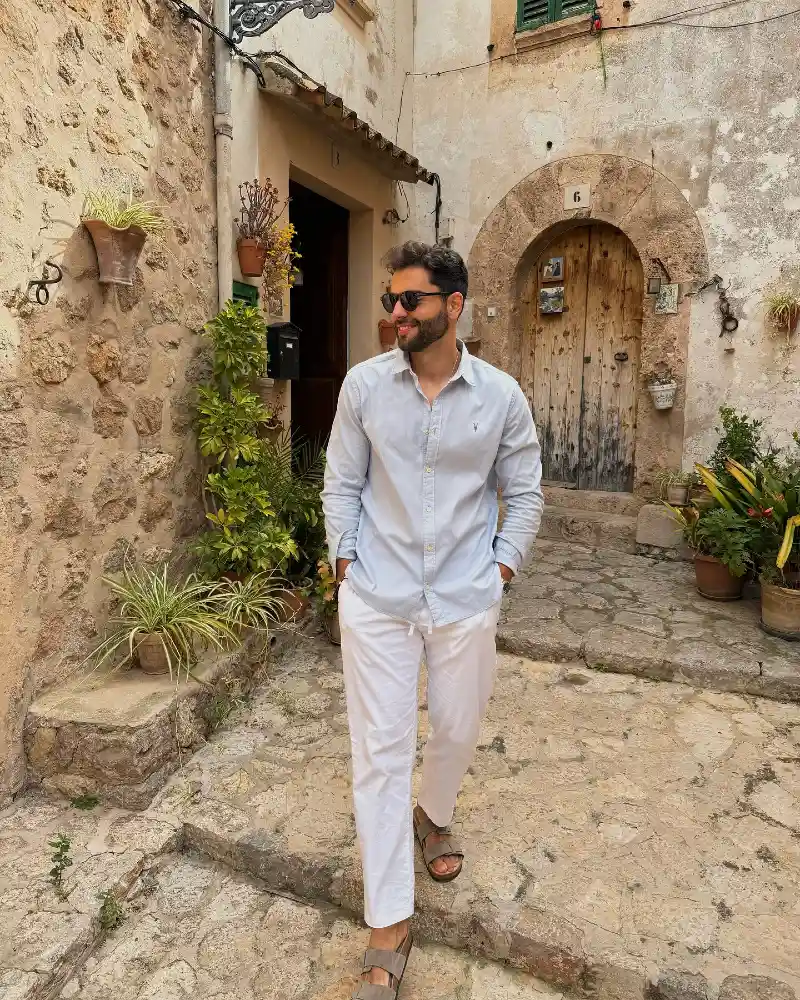 Light Blue Button-Down with White Drawstring Trousers and Suede Sandals