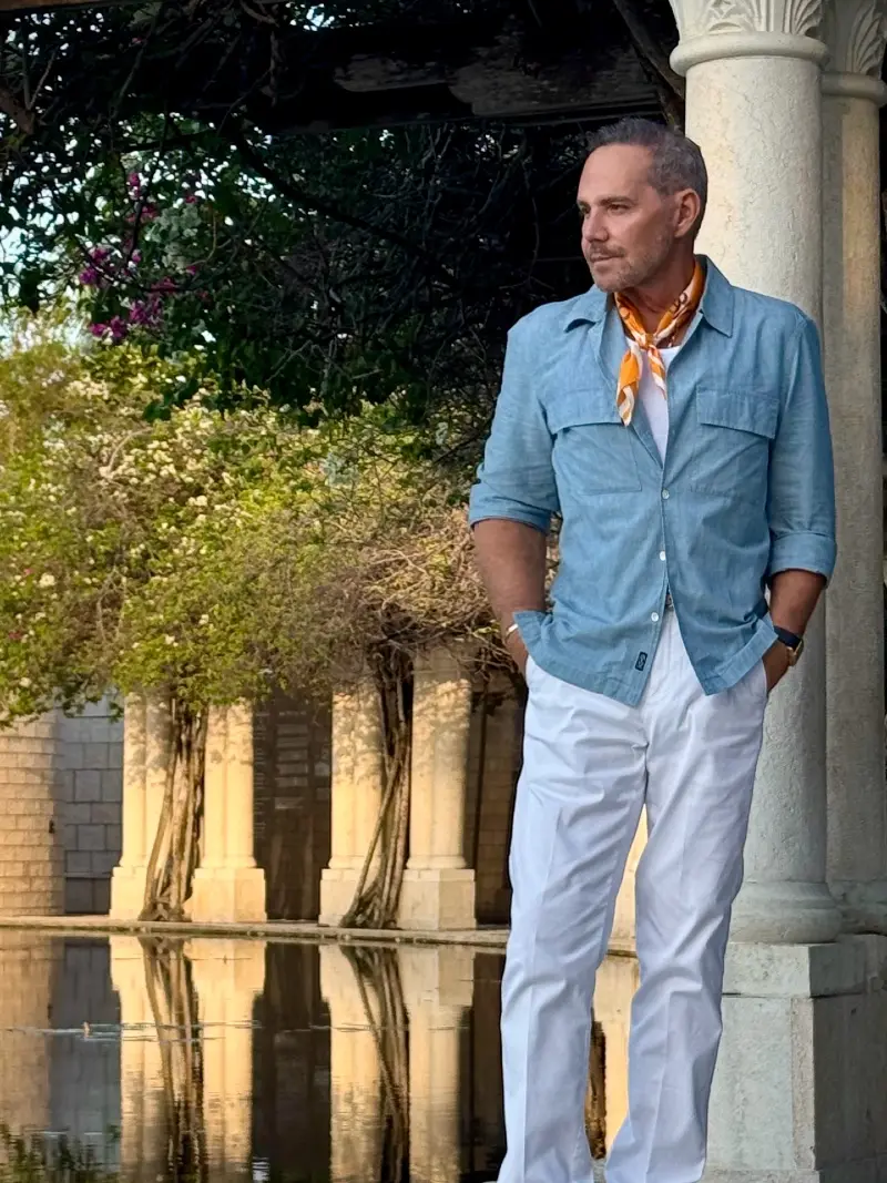 Light Blue Chambray Shirt with White Trousers and Orange Neckerchief