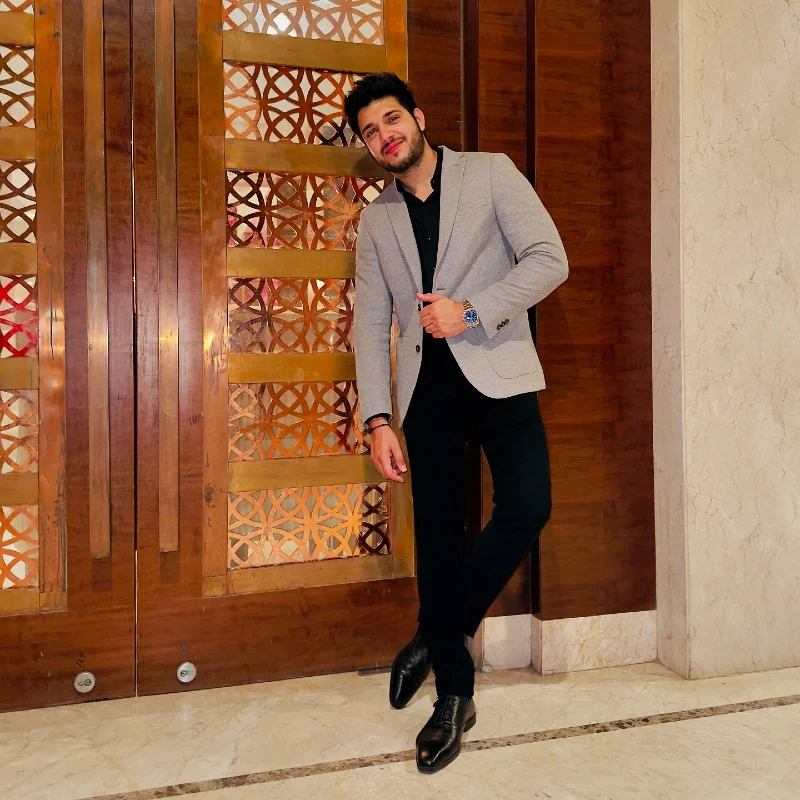 Light Grey Blazer with Black Dress Shirt and Dark Trousers