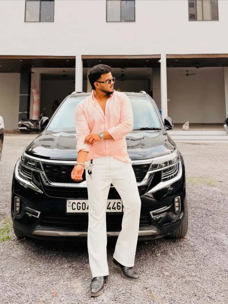 Light Pink Button-Down with White Flared Trousers and Black Boots