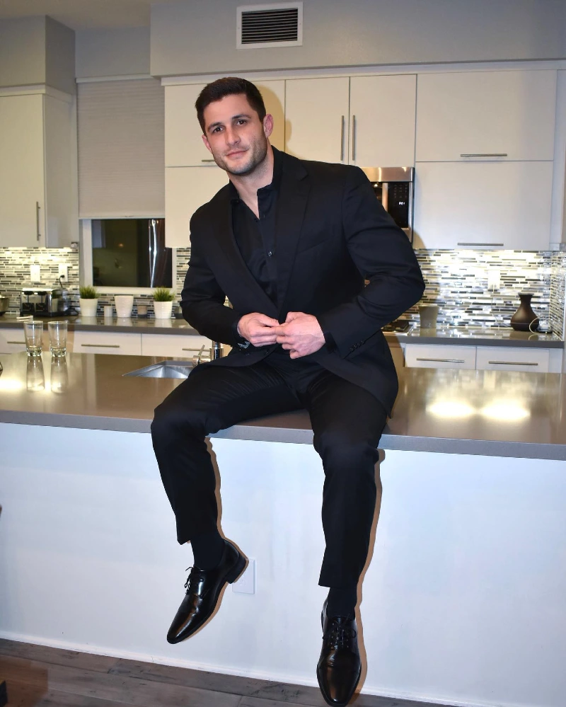 Monochrome Black Suit with Open Collar Shirt and Polished Oxfords