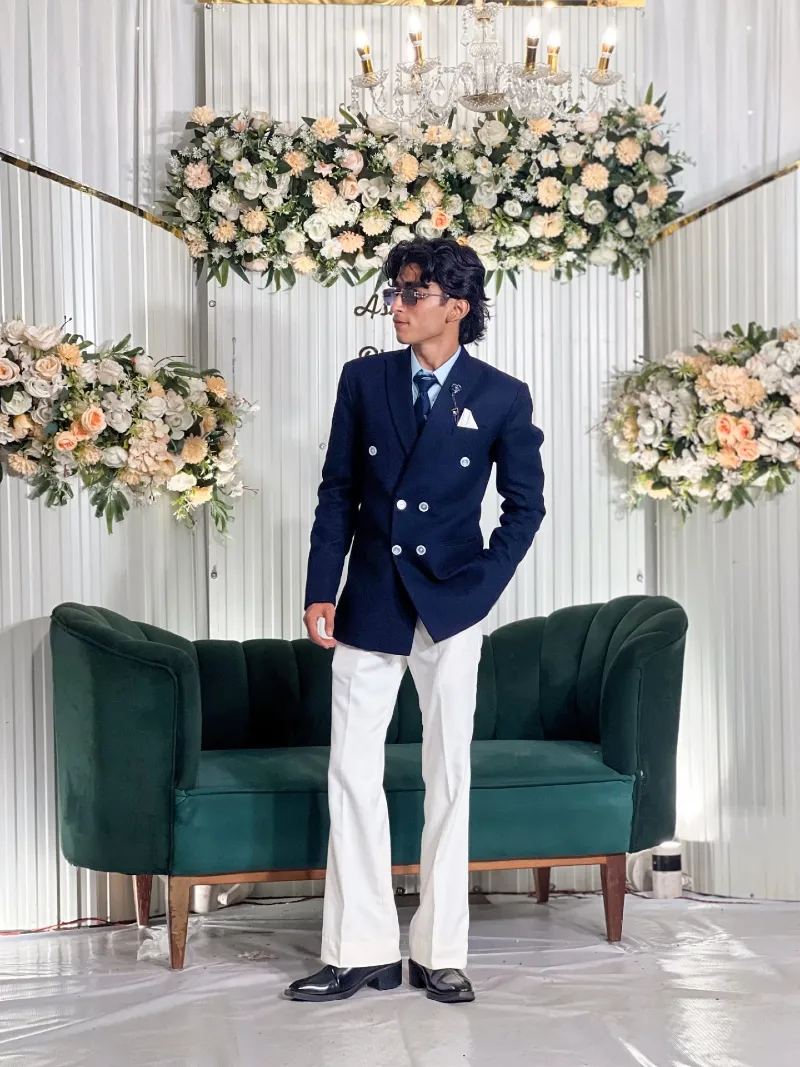 Navy Double-Breasted Jacket with White Trousers and Light Blue Shirt