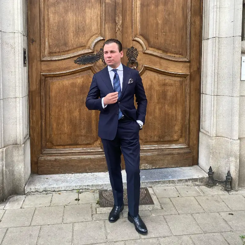 Navy Tailored Suit with Blue Patterned Tie and Black Loafers