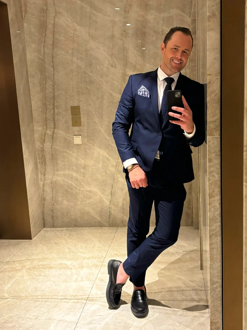 Navy Two-Piece Suit with Patterned Accessories and Chunky Loafers