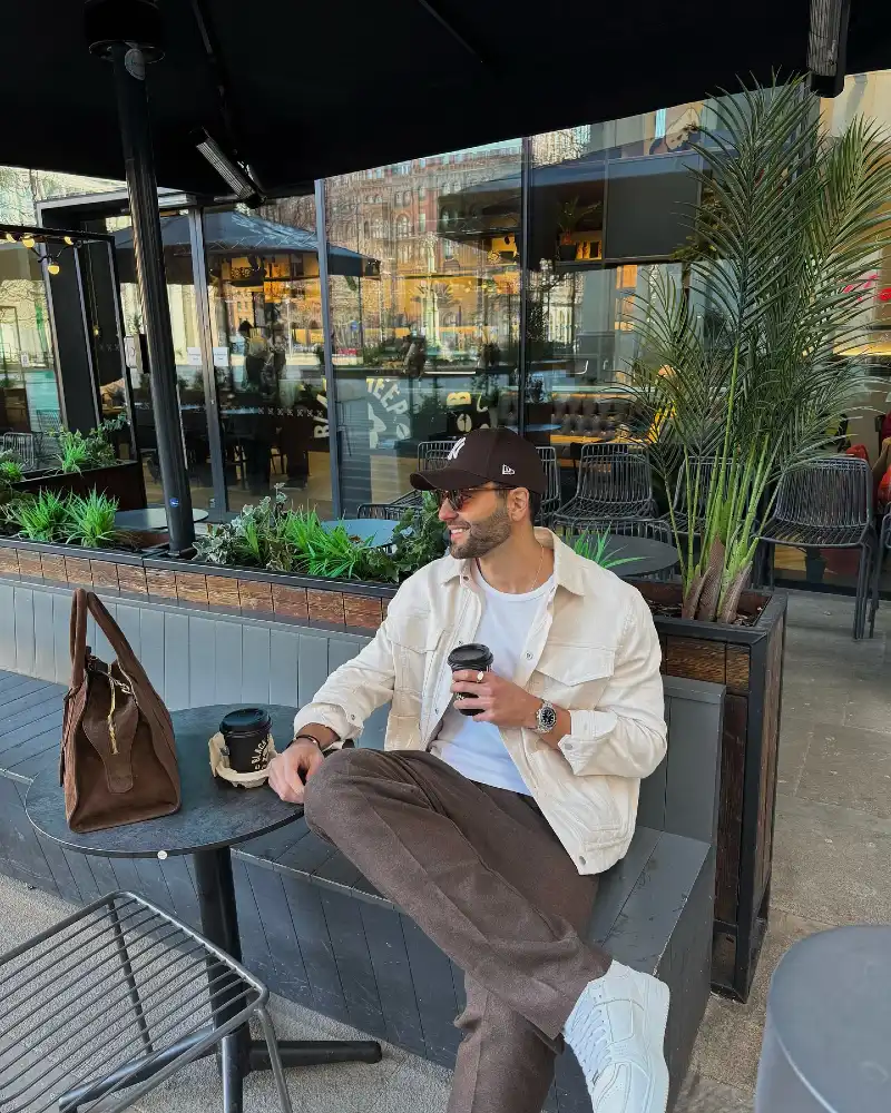 Off-White Trucker Jacket with Brown Trousers and White Sneakers