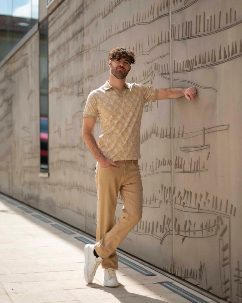 Patterned Tan Polo Shirt with Khaki Jeans and White Sneakers