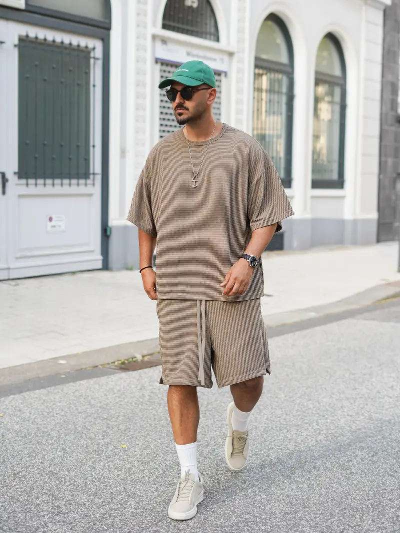 Pleated Taupe Co-Ord Set with Suede Sneakers and Green Cap
