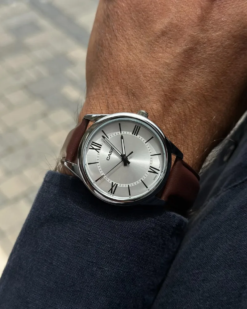 Polished Silver Watch with Sunburst Dial and Brown Leather Strap
