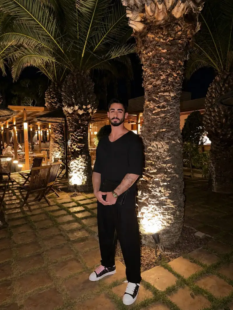 Relaxed Black V-Neck with Loose Trousers and Chunky Sneakers