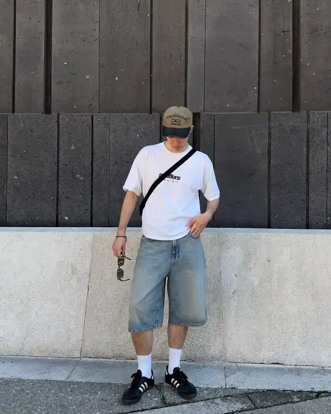Relaxed Graphic Tee, Oversized Denim Shorts, Street Skate Vibe - Cool Summer Essentials for Guys