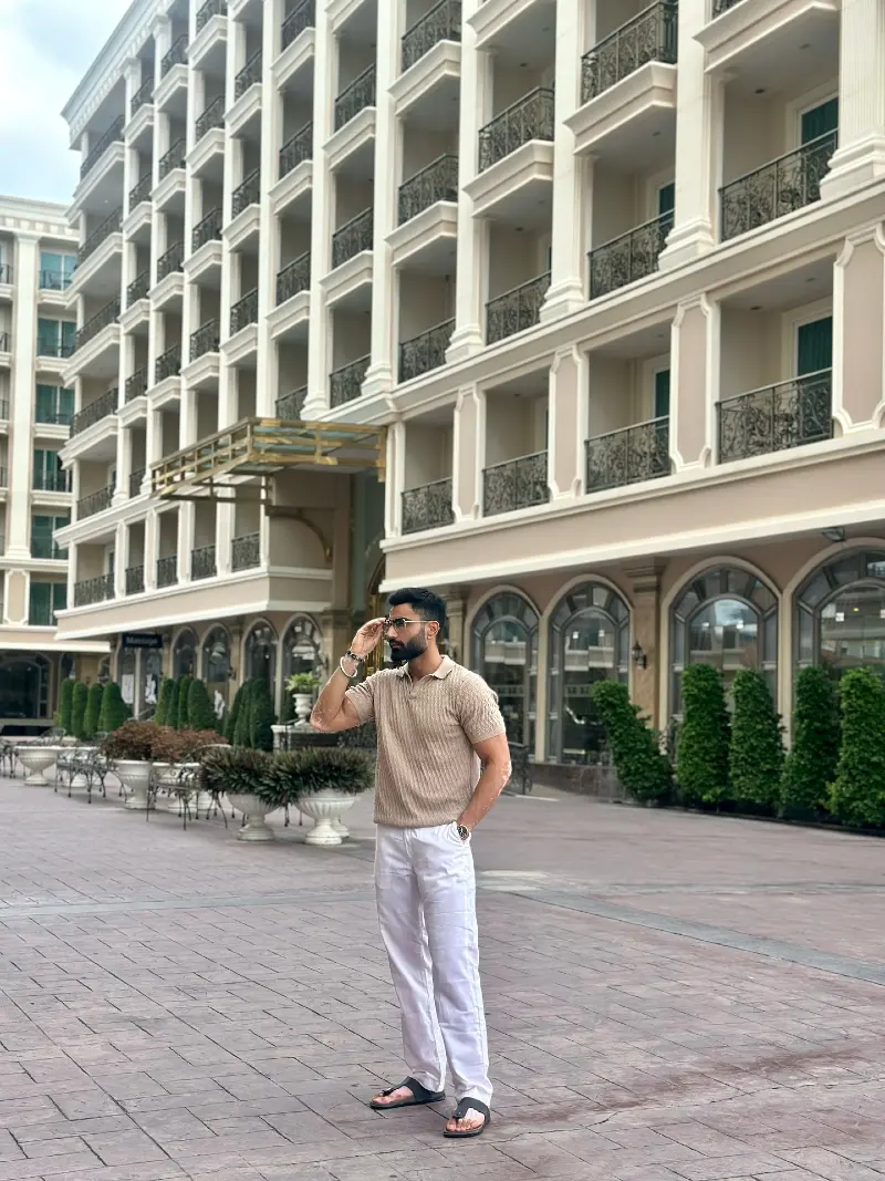 Ribbed Sand Polo with White Trousers and Leather Sandals