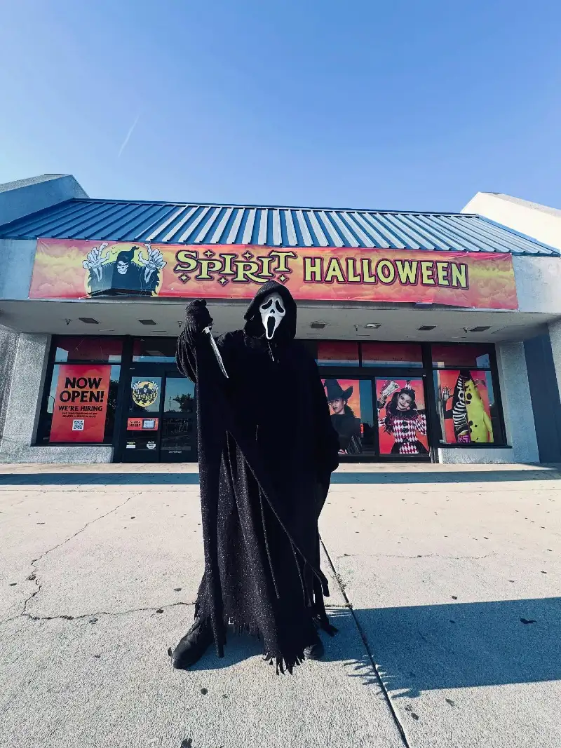 Shimmering Black Metallic Ghost Robe with Tasseled Sleeves and Combat Boots