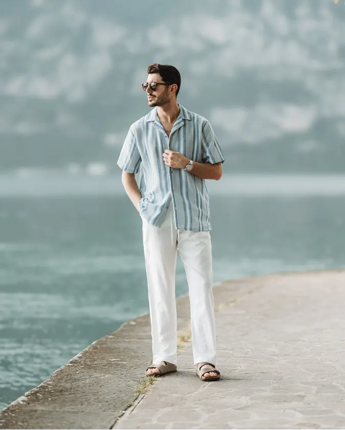 Sky Blue Striped Camp Collar Shirt and Loose White Linen Trousers – Effortless Lakefront Date Night Style