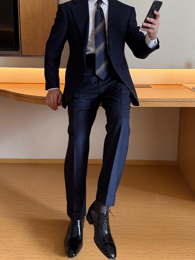 Structured Navy Suit with Striped Tie and Glossy Oxfords