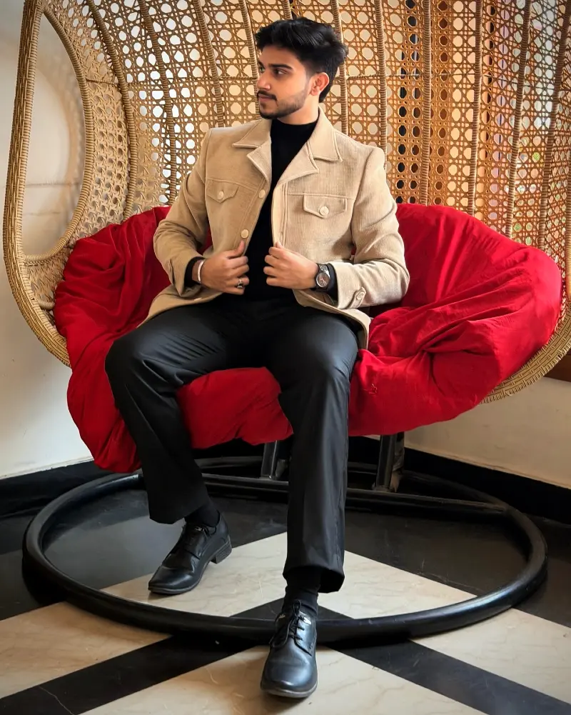Tan Corduroy Jacket Over Black Turtleneck and Trousers