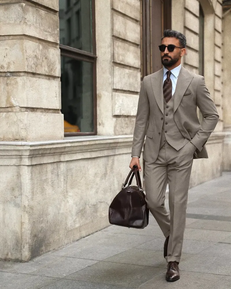 Taupe Three-Piece Suit with Light Blue Shirt and Brown Tie