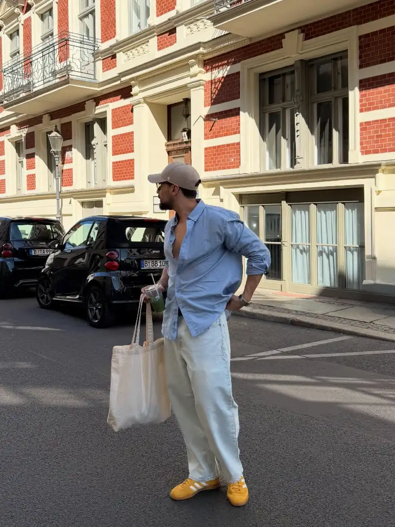 Unbuttoned Light Blue Shirt with Pale Baggy Jeans and Yellow Sneakers