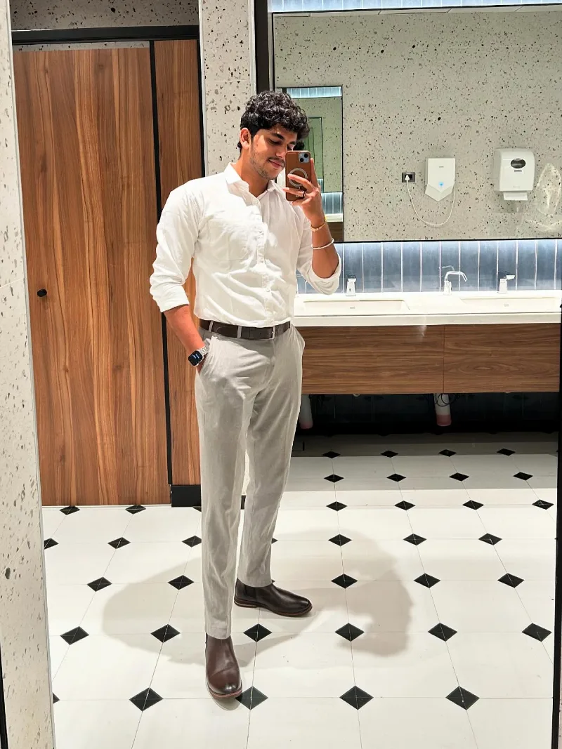 White Button-Down Shirt with Light Grey Trousers and Brown Chelsea Boots