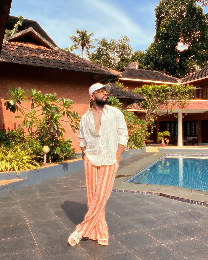 White Crinkled Shirt with Orange Striped Knit Trousers