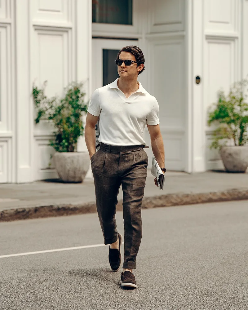White Knit Polo with Brown Pleated Trousers and Suede Loafers
