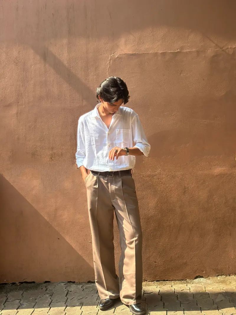 White Linen Shirt with Khaki Pleated Trousers and Black Leather Shoes